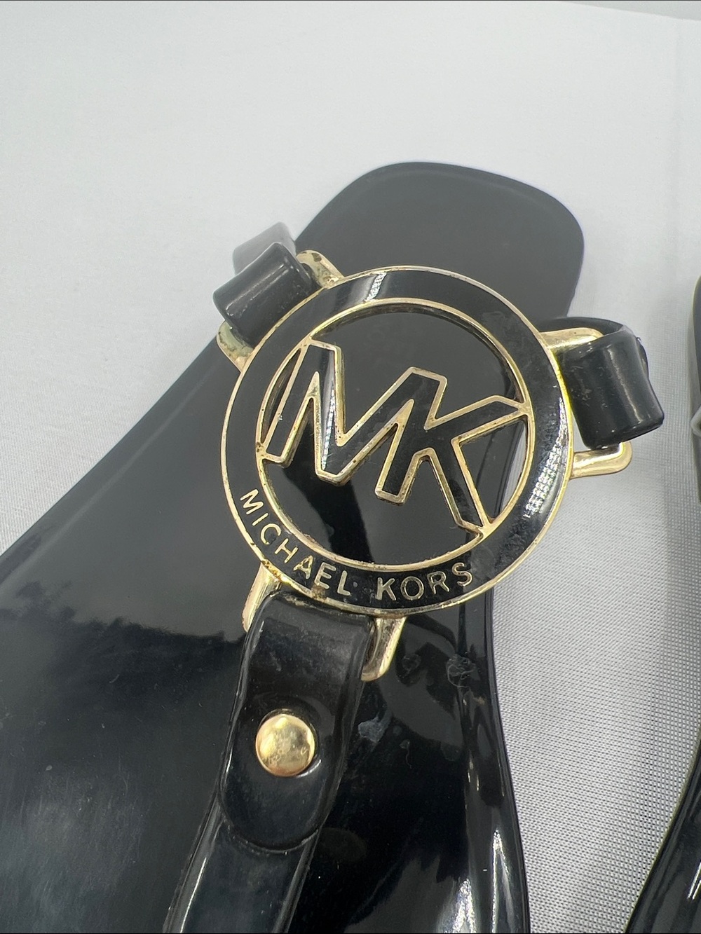 Michael Kors Black Gloss Jelly Logo Thong Sandals with Gold Accents - Picture 2 of 6